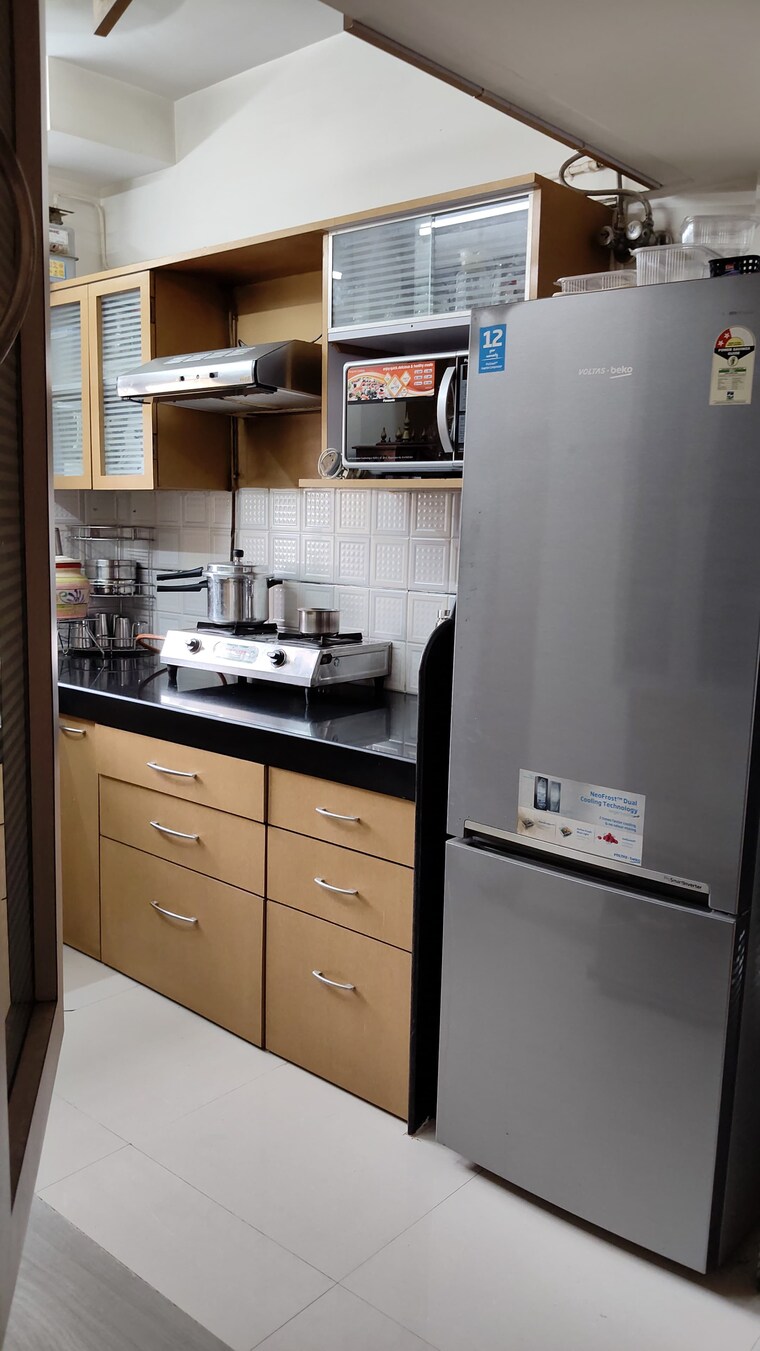 Kitchen, pratha-pushpa-society 2 Bedroom 700 Sq.Ft. Apartment In Ghodbunder Road Thane 9382007