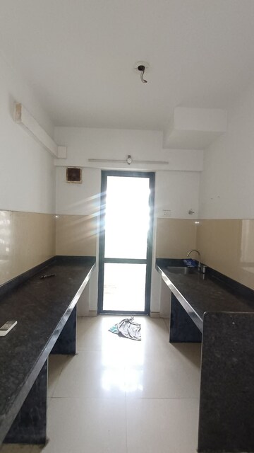 Kitchen in 1 BHK Apartment at Lodha Palava Downtown, Dombivli East – for Sale