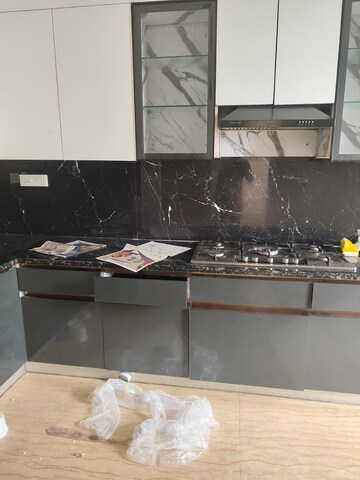 Kitchen in 4 BHK Apartment at Mahagun Mezzaria, Sector 78 – for Rent