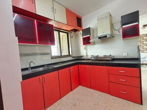 Kitchen in 3 BHK Apartment at Swastik Regalia, Waghbil – for Rent