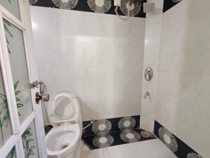 Bathroom in 3 BHK Apartment at Swastik Regalia, Waghbil – for Rent
