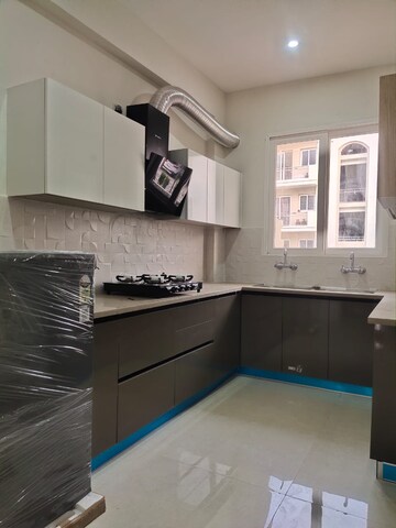 Kitchen in 3 BHK Builder Floor at Prem Satyam Swastik Apartment, Patiala Road – for Sale