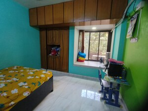 Bedroom in 2 BHK Apartment at Parijat Gardens Marigold CHS, Kasarvadavali – for Rent