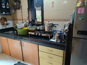 Kitchen in 2 BHK Apartment at Parijat Gardens Marigold CHS, Kasarvadavali – for Rent