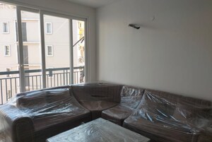 Living Room in 2 BHK Apartment at Maxxus Elanza, International Airport Road – for Rent