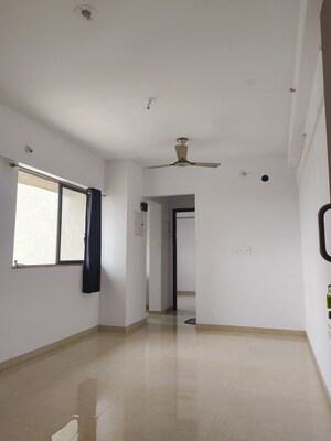 Living Room in 1 BHK Apartment at Lodha Lakeshore Greens, Dombivli East – for Sale