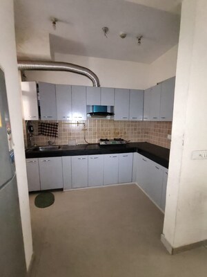 Kitchen in 2 BHK Apartment at Mahagun Mywoods, Sector 16c Greater Noida – for Rent