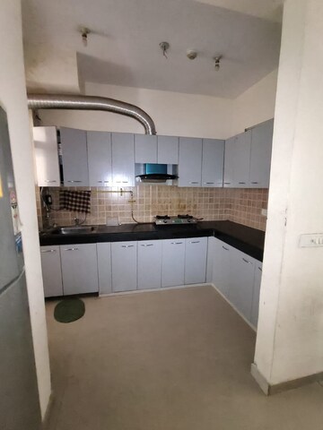 Kitchen in 2 BHK Apartment at Mahagun Mywoods, Sector 16c Greater Noida – for Rent
