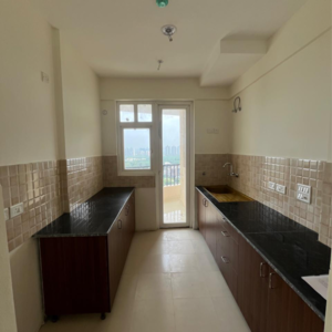 Kitchen in 2 BHK Apartment at Amrapali Heartbeat City, Sector 107 – for Rent