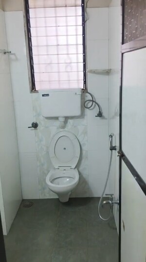 Bathroom in 2 BHK Apartment at Miraj Residency, Malad West – for Rent