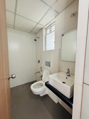 Bathroom in 1 BHK Apartment at Puranik City, Kasarvadavali – for Rent