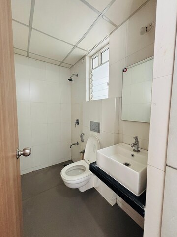 Bathroom in 1 BHK Apartment at Puranik City, Kasarvadavali – for Rent