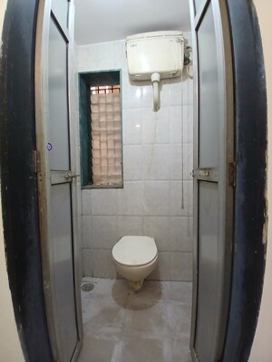 Bathroom in 1 BHK Apartment at Nisarg CHSL, Goregaon East – for Rent