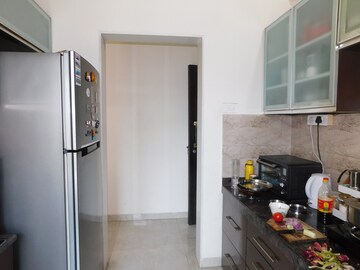 Kitchen in 4 BHK Apartment at Harmony Sky Suites, Ghodbunder Road – for Rent