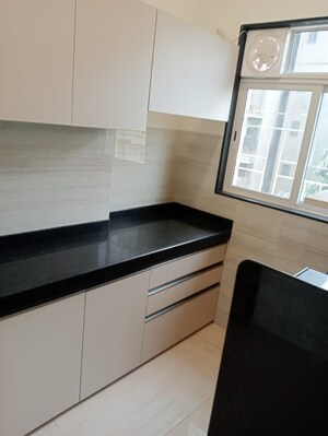 Kitchen in 1 BHK Apartment at Lashkaria Pearl, Jogeshwari West – for Sale