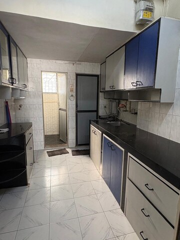 Kitchen in 1 BHK Apartment at Adarsh Nagar CHS Worli, Worli – for Rent