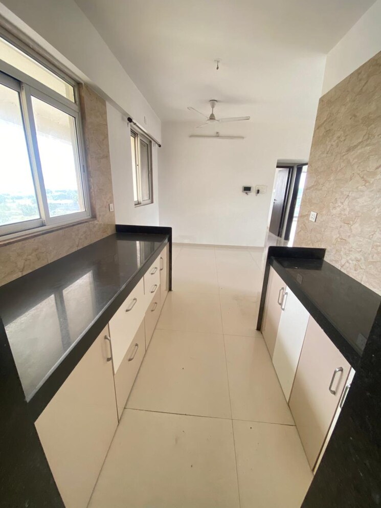 Kitchen, benchmark-cyprus 2 Bedroom 875 Sq.Ft. Apartment In Punawale Pune 9387638