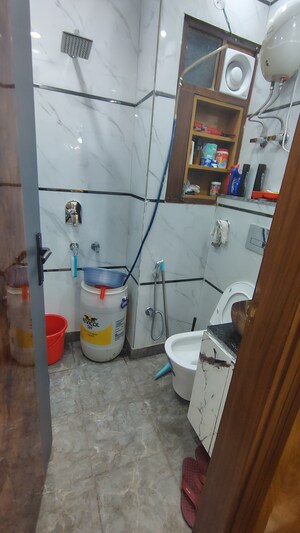 Bathroom in 4 BHK Builder Floor at Dwarka Mor – for Rent