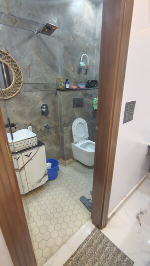Bathroom in 4 BHK Builder Floor at Dwarka Mor – for Rent