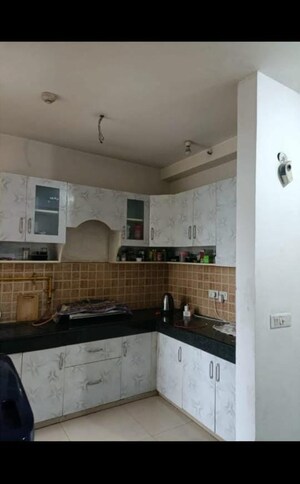 Kitchen in 2 BHK Apartment at Mahagun Mywoods, Sector 16c Greater Noida – for Rent