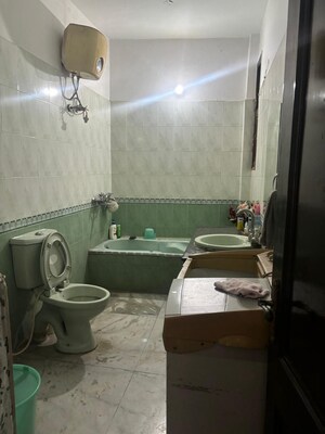 Bathroom in 4 BHK Apartment at Shiwalik Greens, Dhakoli – for Sale