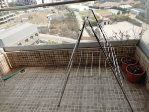 Balcony in 2 BHK Apartment at Axis Paradigm Whistling Meadows, Paud Road – for Rent
