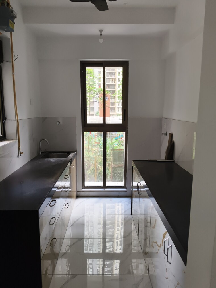 Kitchen, raymond-ten-x-habitat 2 Bedroom 850 Sq.Ft. Apartment In Pokhran Road No Two Thane 9391575