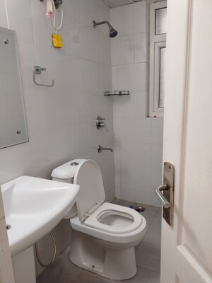 Bathroom in 2 BHK Apartment at Dhoot Time Residency, Sector 63 – for Rent