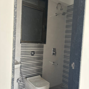 Bathroom in 2 BHK Apartment at Divine Aspen Garden, Sonawala Industry Estate – for Sale