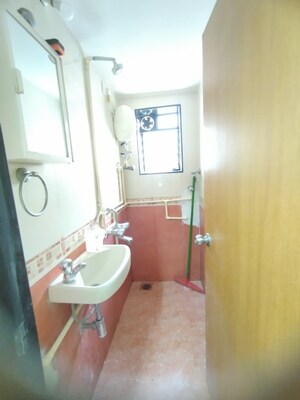 Bathroom in 1 BHK Apartment at Bhagya Nagar CHSL, Mahim West – for Rent