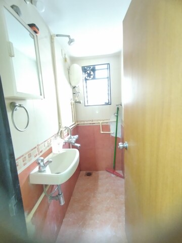 Bathroom in 1 BHK Apartment at Bhagya Nagar CHSL, Mahim West – for Rent