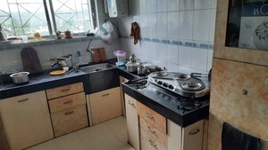 Kitchen in 2 BHK Apartment at Mahalaxmi Nagar CHS, Warje – for Rent