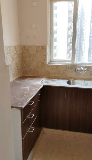 Kitchen in 2.5 BHK Apartment at Amrapali Golf Homes, Sector 4 Greater Noida – for Sale