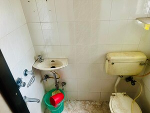 Bathroom in 2 BHK Apartment at Veena Nagar CHS, Mulund West – for Rent