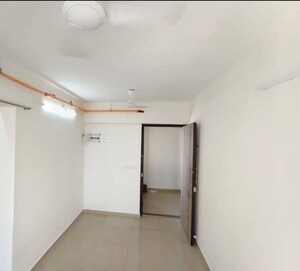 Room in 2 BHK Apartment at Andheri CHS, Andheri West – for Rent