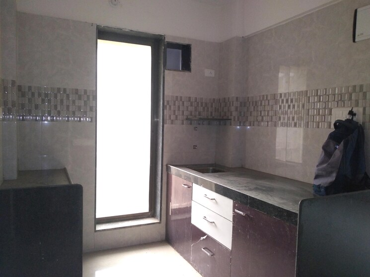 Kitchen, om-sai-heights-phase-ii 1 Bedroom 555 Sq.Ft. Apartment In Morya Nagar Palghar 9399490