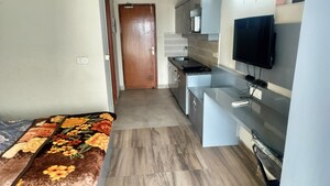 Living Room in 1 BHK Apartment at Paramount Golfforeste, Zeta I Greater Noida – for Rent