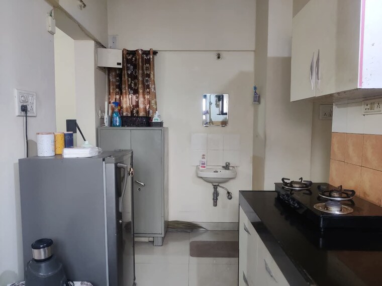 Kitchen, magarpatta-city-heliconia 1 Bedroom 750 Sq.Ft. Apartment In Hadapsar Pune 9399715