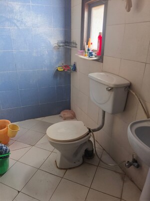 Bathroom in 2 BHK Apartment at Nilaya Greens, Raj Nagar Extension – for Rent