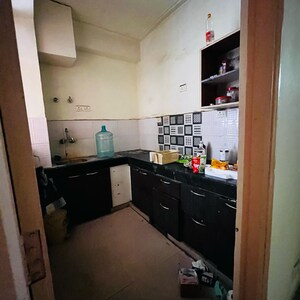 Kitchen in 2 BHK Apartment at Nitishree Aura Chimera, Raj Nagar Extension – for Rent