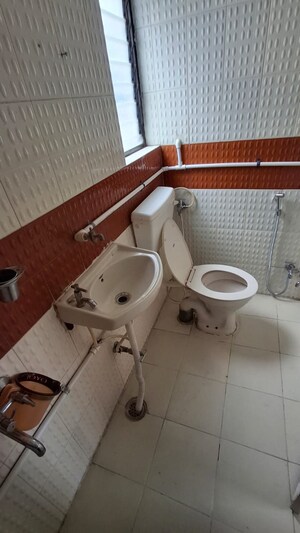 Bathroom in 2 BHK Apartment at Ramkrishna Paradise, Dhayari – for Rent