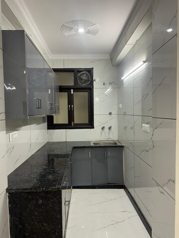 Kitchen in 1.5 BHK Builder Floor at Rajpur Khurd Extension – for Rent