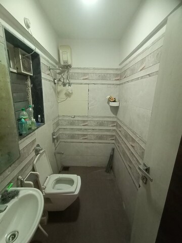 Bathroom in 2 BHK Apartment at Azad Nagar Sangam CHS, Andheri West – for Rent