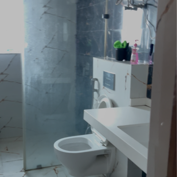 Bathroom in 4 BHK Apartment at Rohit Height, Viram Khand – for Sale
