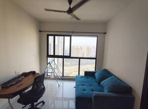Living Room in 1 BHK Apartment at Lodha Crown Quality Homes, Majiwada – for Rent