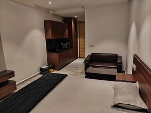 Living Room in Studio Apartment at Gaur City Center, Sector 4 Greater Noida – for Rent