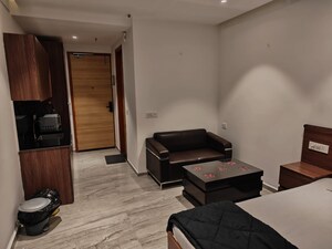 Living Room in Studio Apartment at Gaur City Center, Sector 4 Greater Noida – for Rent