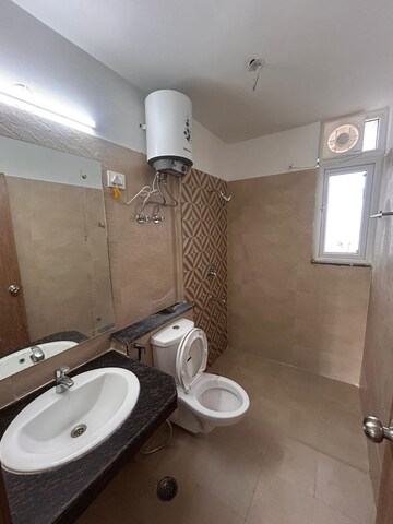 Bathroom in 3 BHK Apartment at ATS Homekraft Pious Hideaways, Sector 150 – for Rent