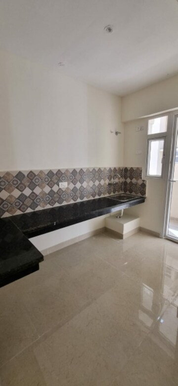 Kitchen in 2 BHK Apartment at Signature The Millennia 3, Sector 37d – for Rent