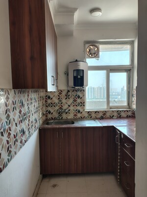 Kitchen in 2 BHK Apartment at Amrapali Riverview, Amrapali Leisure Valley – for Rent